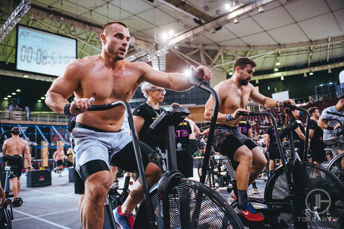 Athletes on Assault Bikes