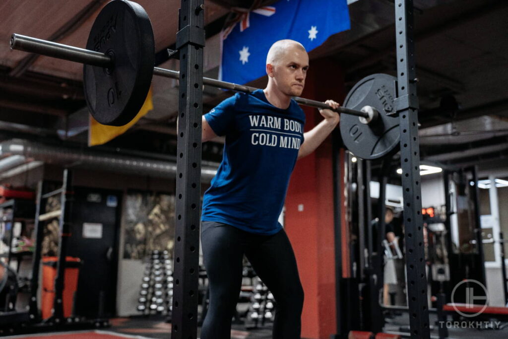 Athlete using a squat rack