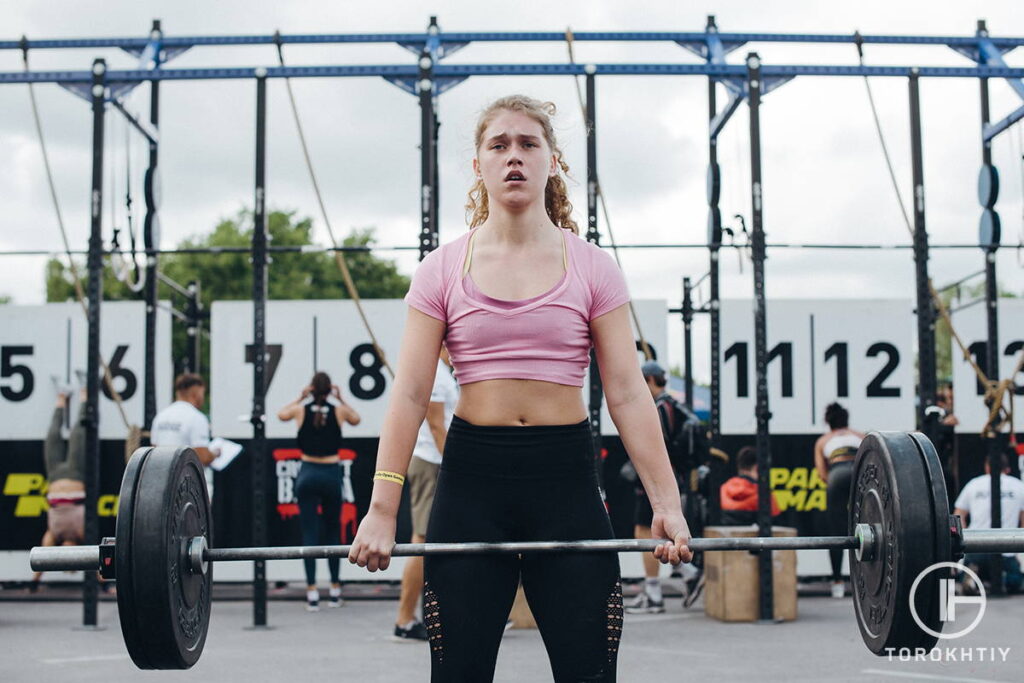 WBCM Female deadlifting using hook grip