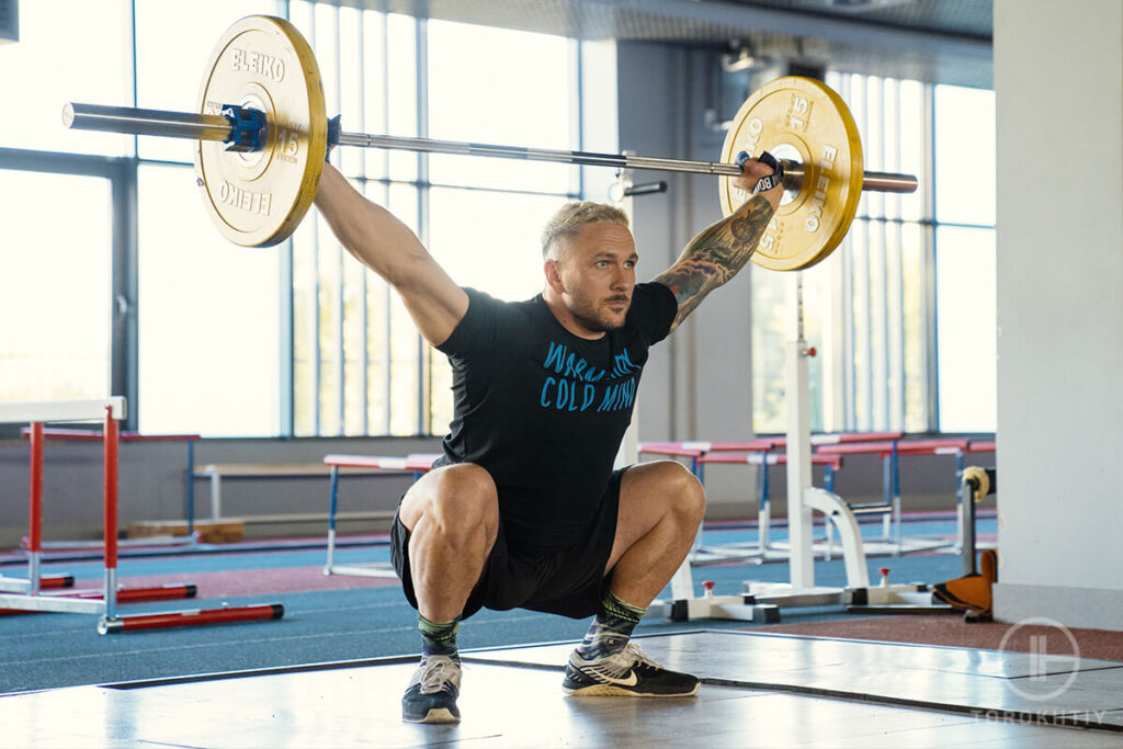 athlete weightlifting in gym