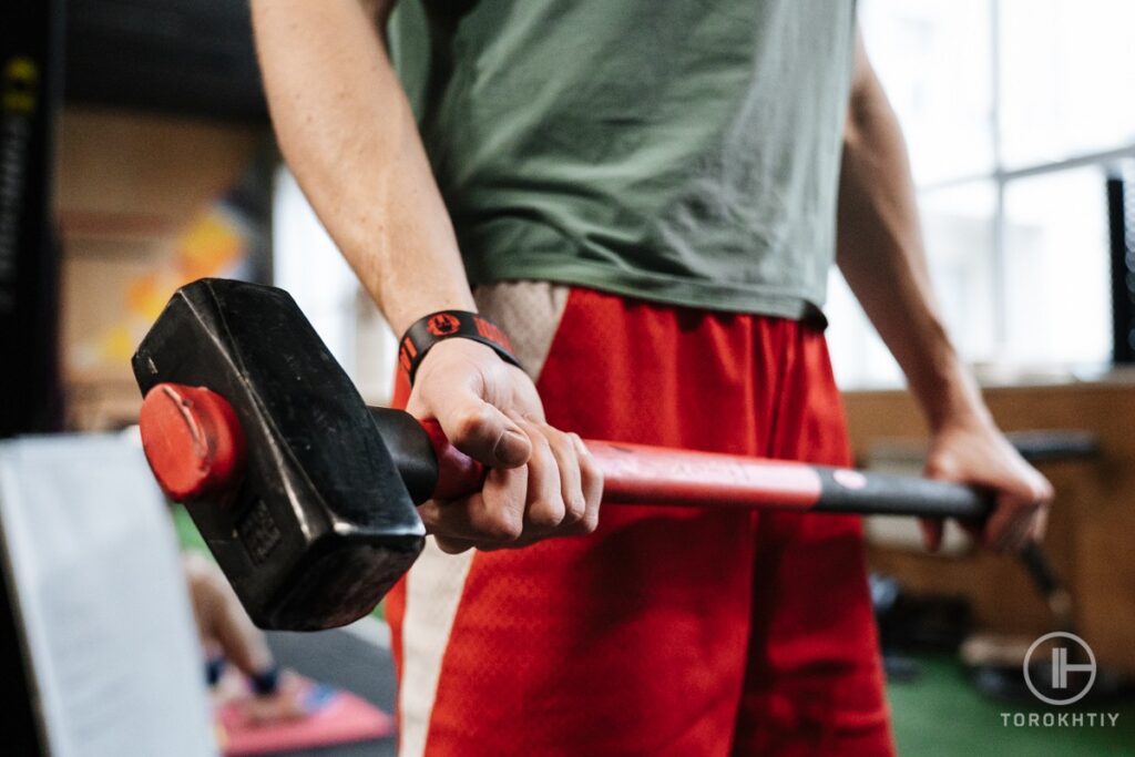 Men With Exercise Hammer