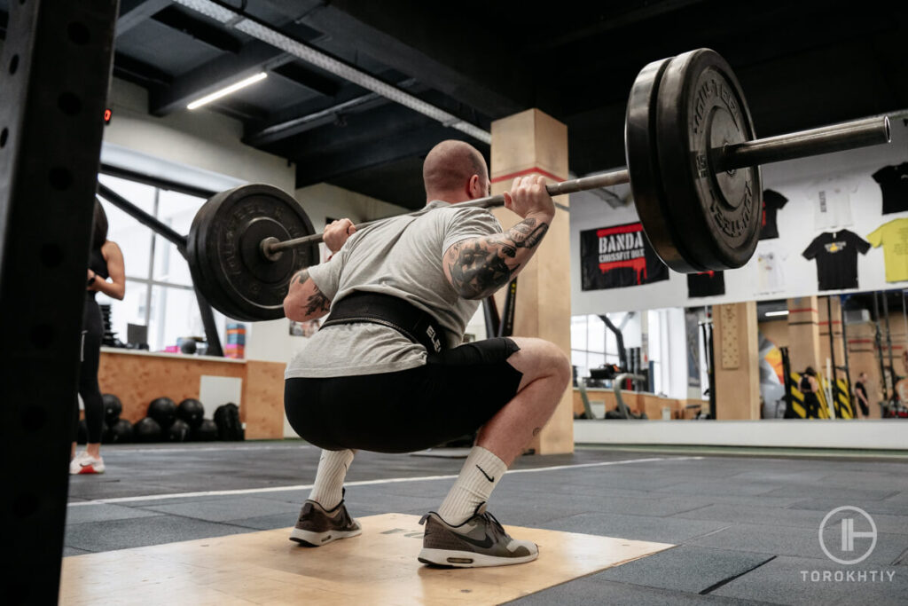 Squatting by Athlete