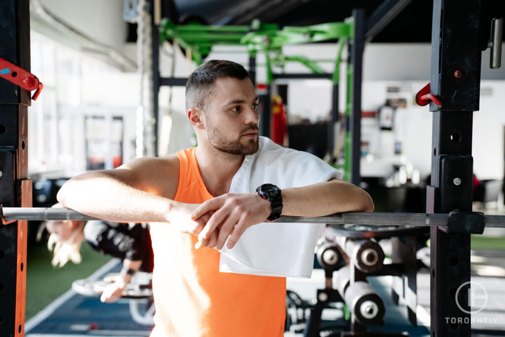 Athlete Relax After Training Holding Towel