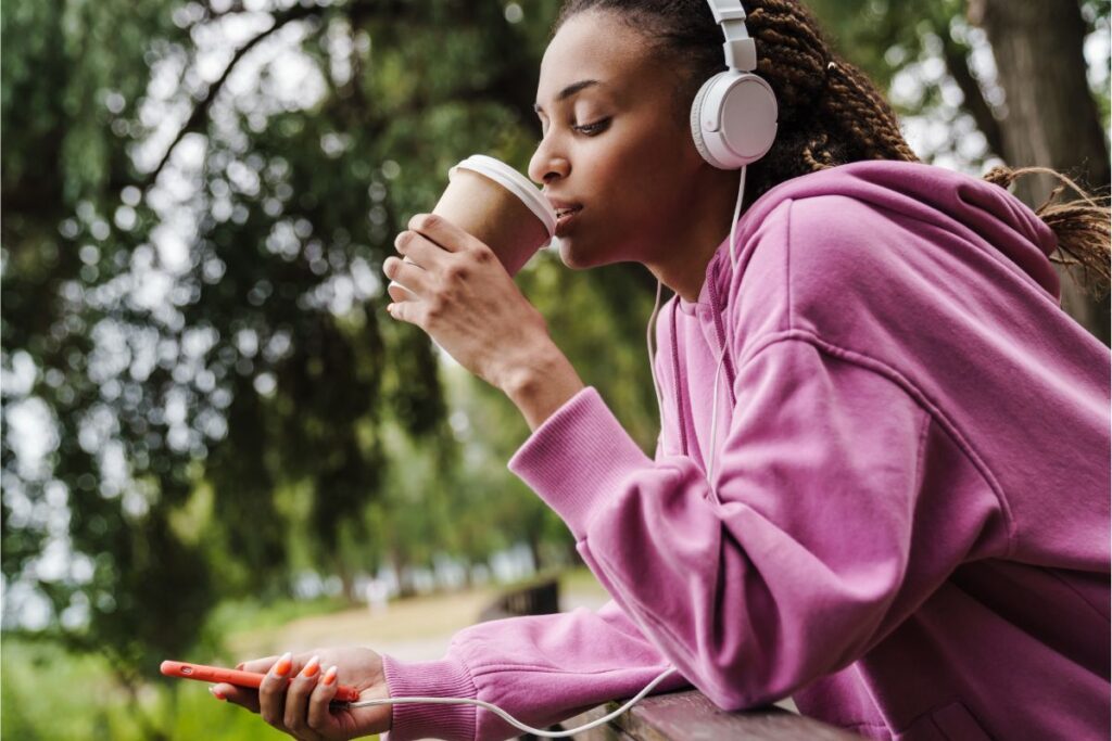 Woman drinks coffee after training