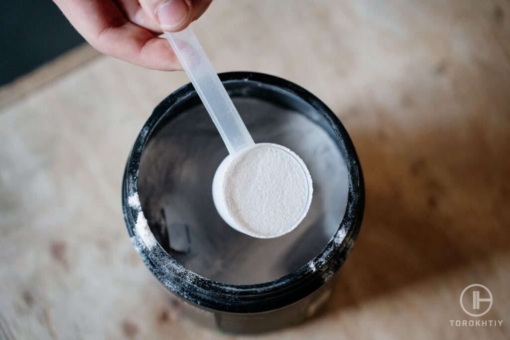 Man Takes Collagen Powder from Bottle