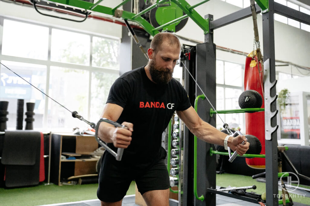 Man Training Using Cable Machine