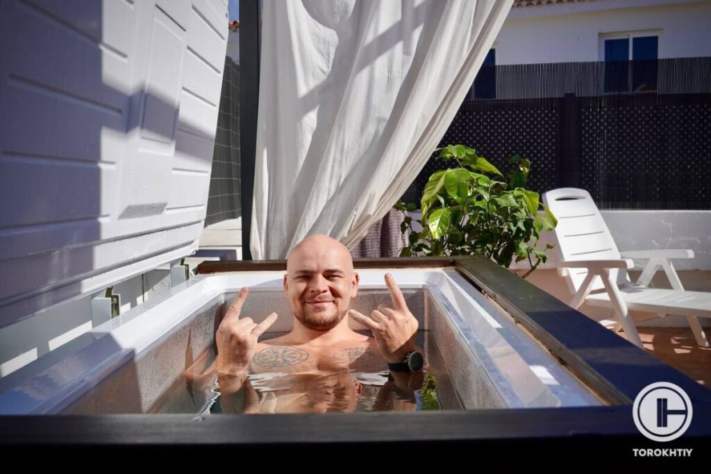 athlete taking ice bath