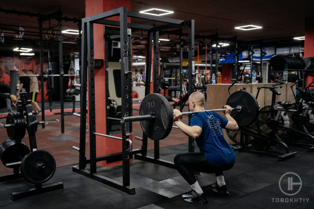 Squats using power rack