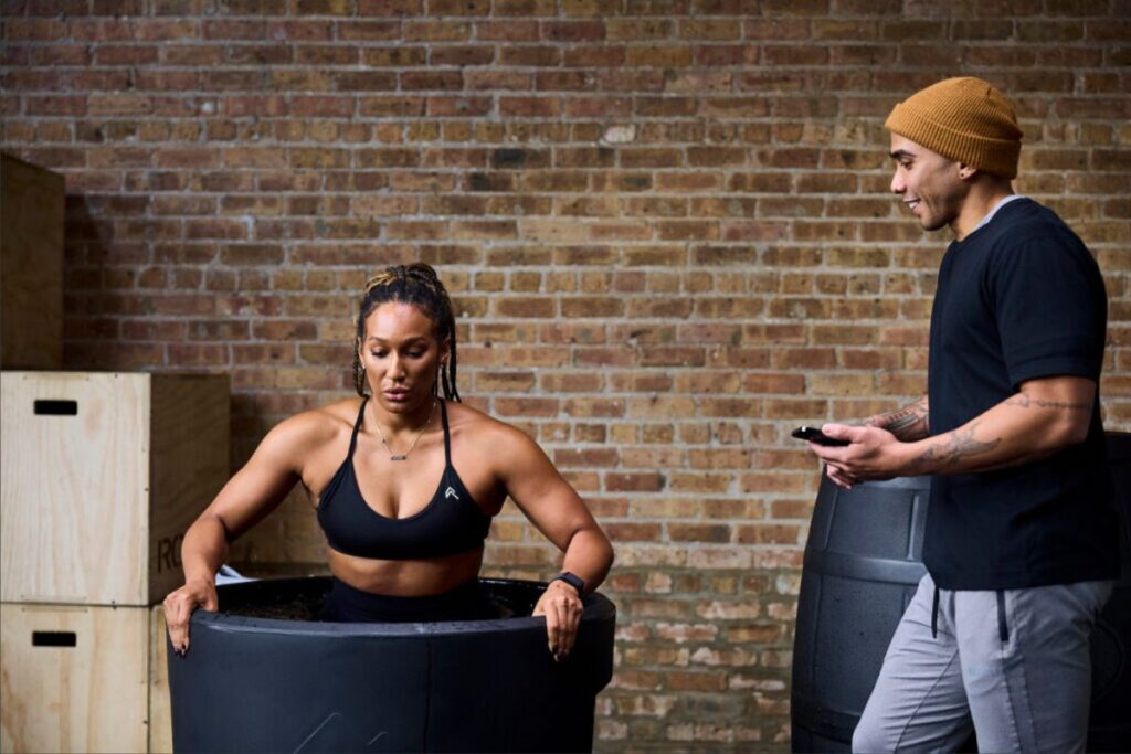 woman gets in ice bath