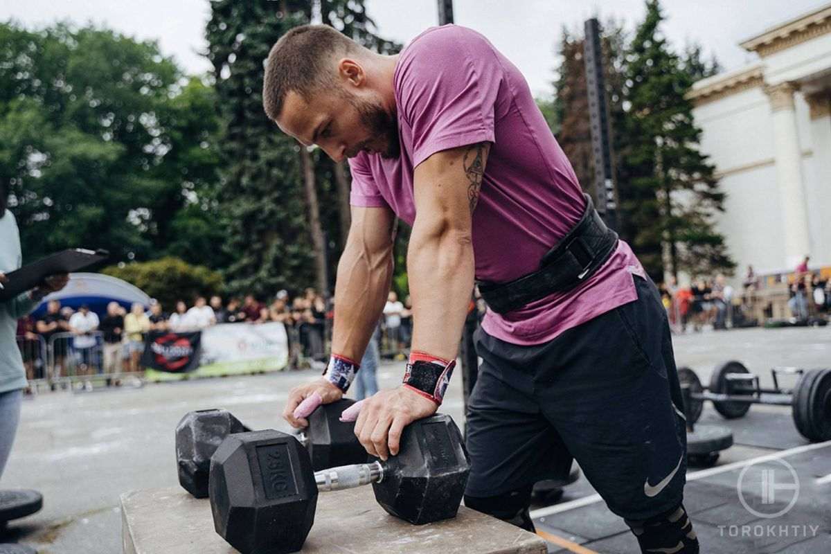 Man has a exercise with dumbbell