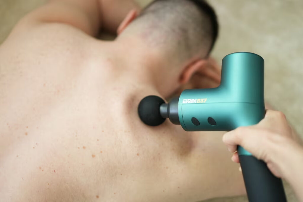 massage gun in use