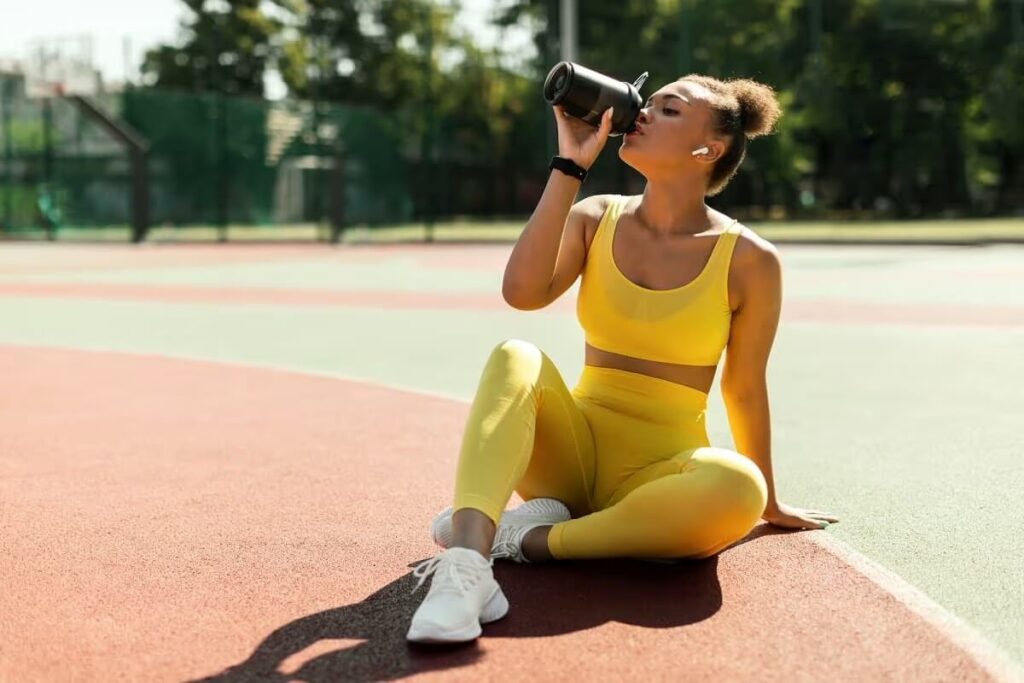 athlete drinking protein shake