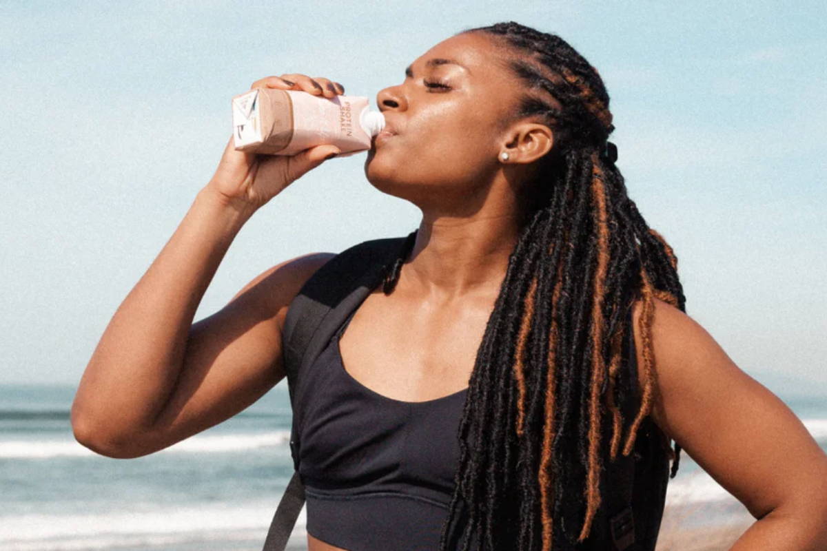 Athlete drinking protein shake with milk