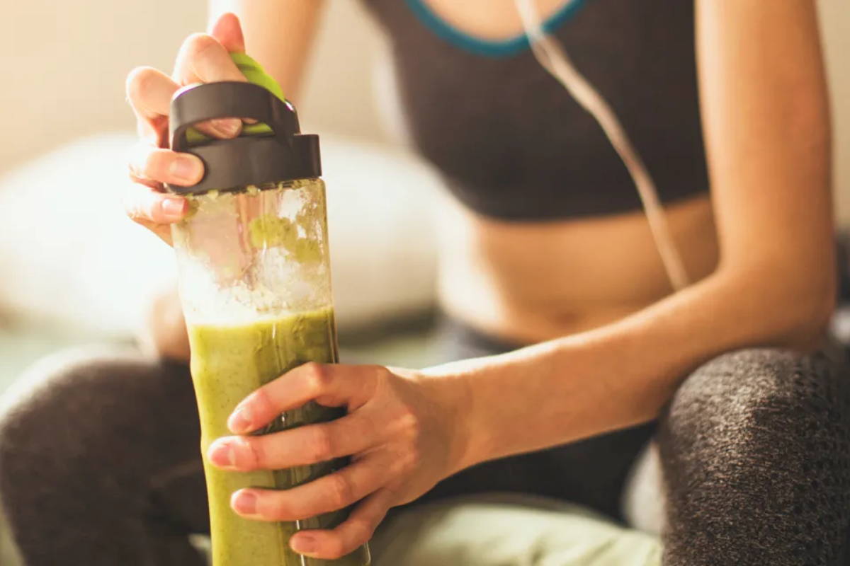 Athlete making her protein shake