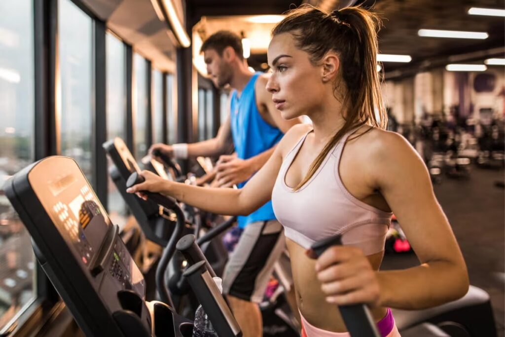 athlete training on front drive elliptical