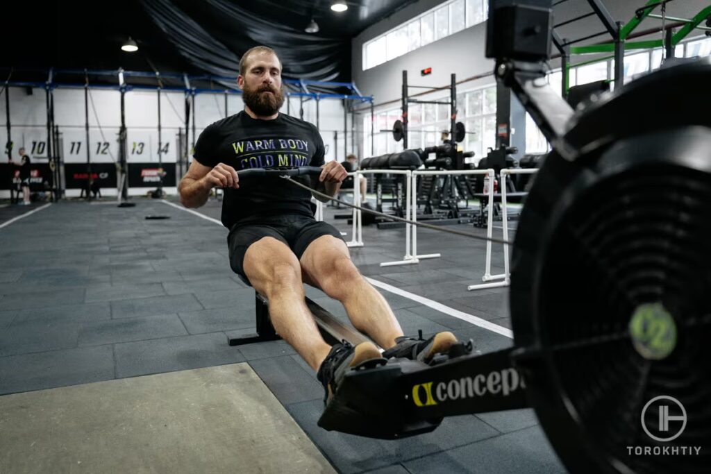 athlete training on rowing machine