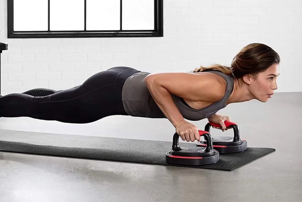 athlete training with push-up bars