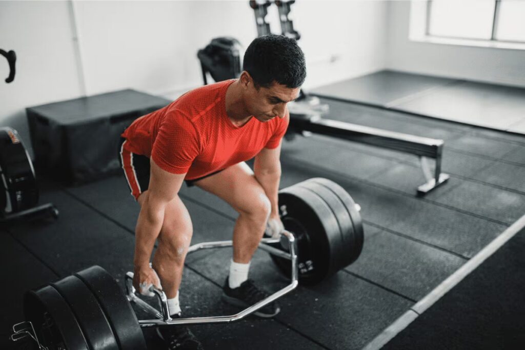 athlete with a trap bar deadlifting