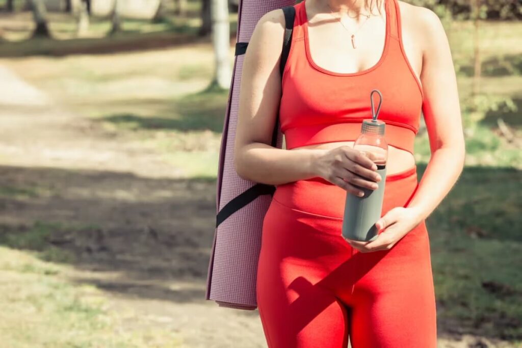 athlete and the bottle of protein shake