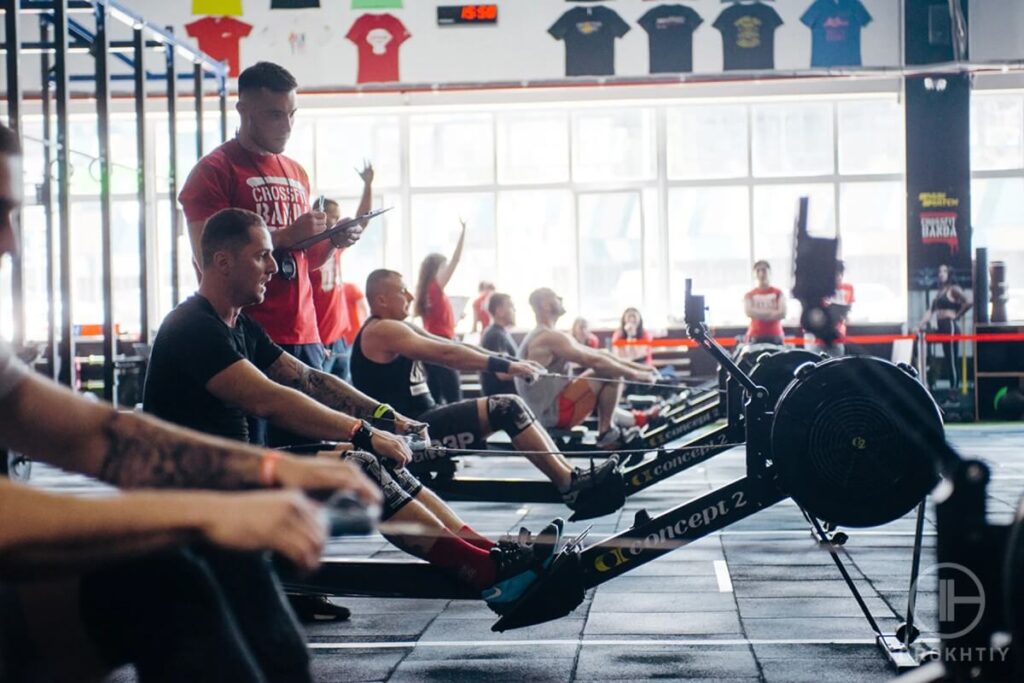 athletes rowing in gym