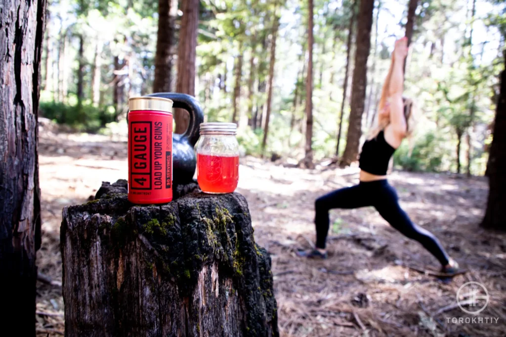 woman training drinking creatine