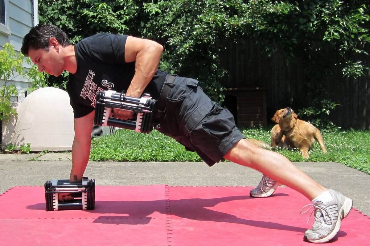 Man training with PowerBlock Elite Dumbbells