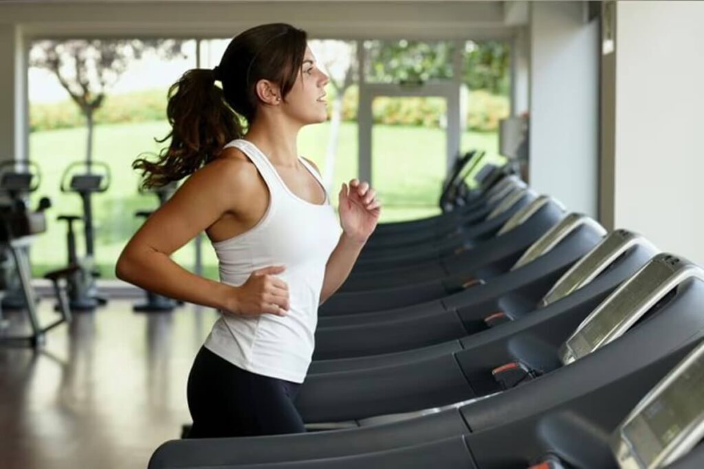 female athlete running on treadmill