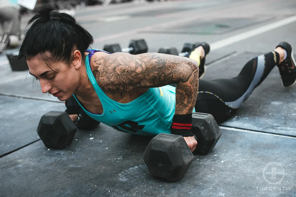 Woman exercises with dumbbells