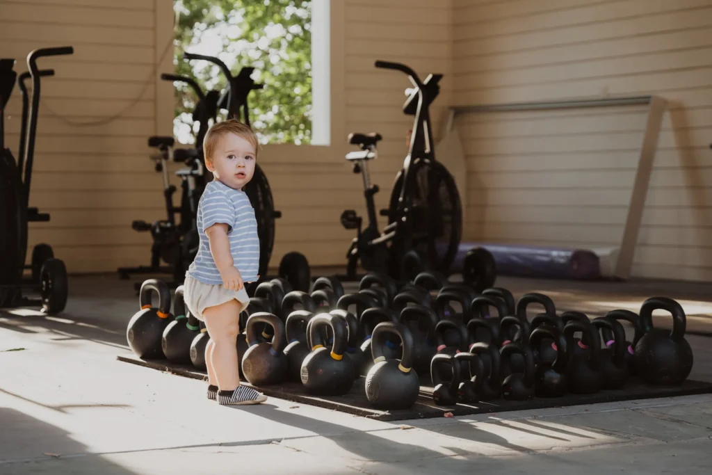 baby near kettlebells