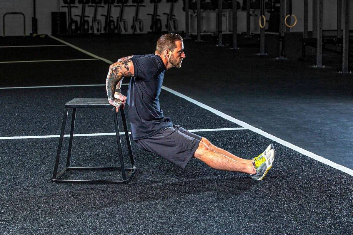 Male athlete training on plyo box