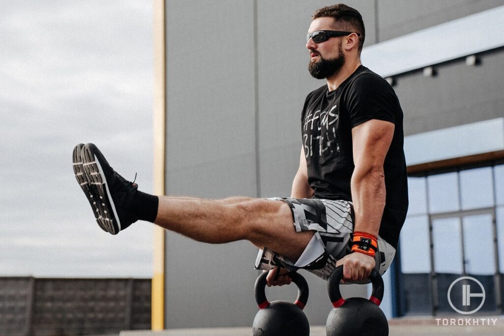 man doing kettlebell exercise