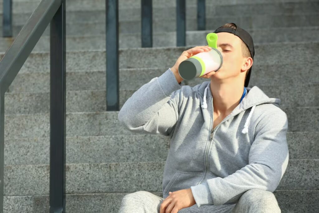 man drinking protein shake