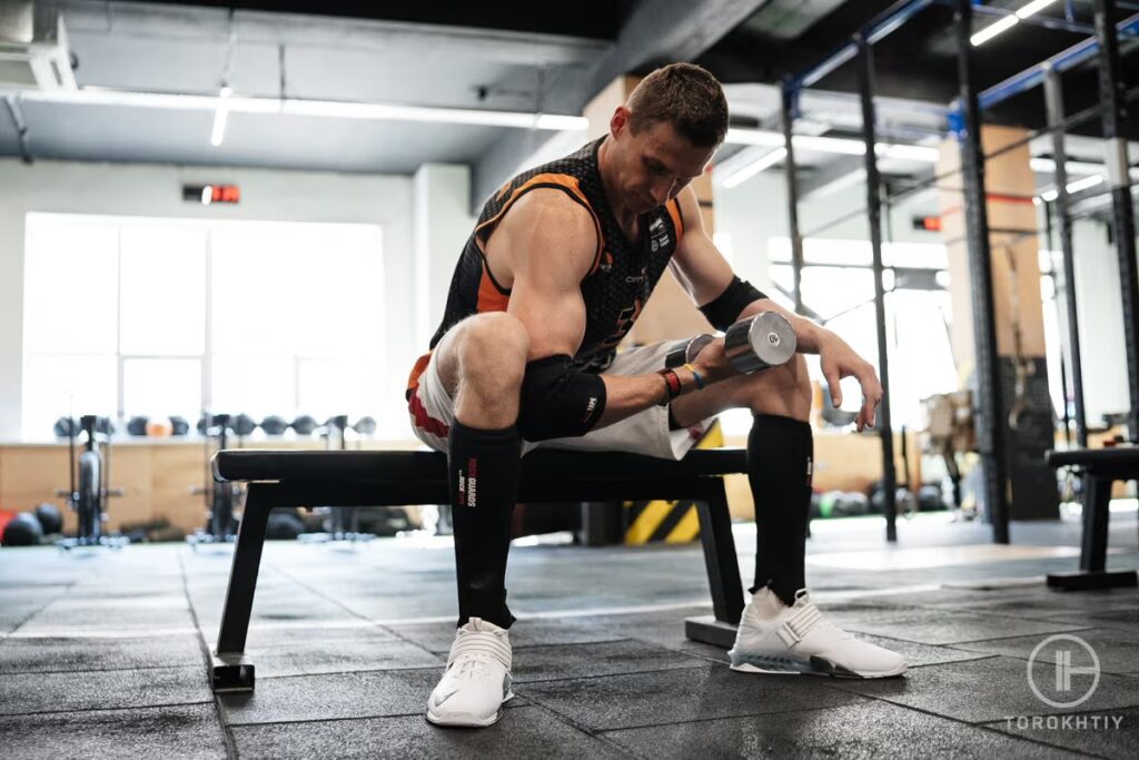 man workout on weighted bench