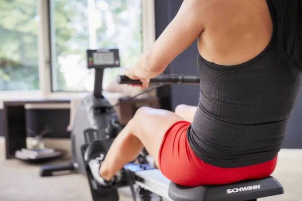 woman using rower machine