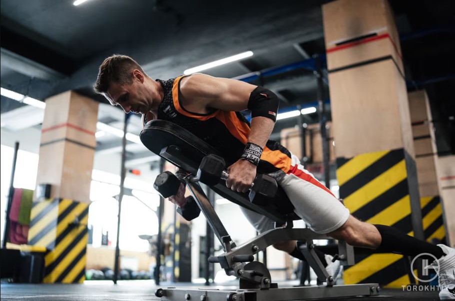 athlete training on weighted bench