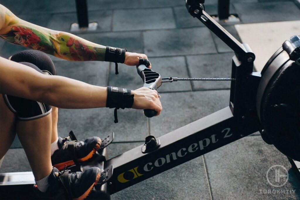 athlete rowing in gym