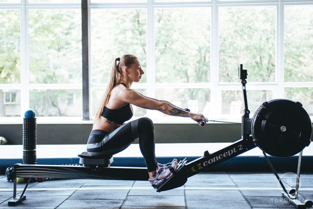 Female Workout on Rowing Machine