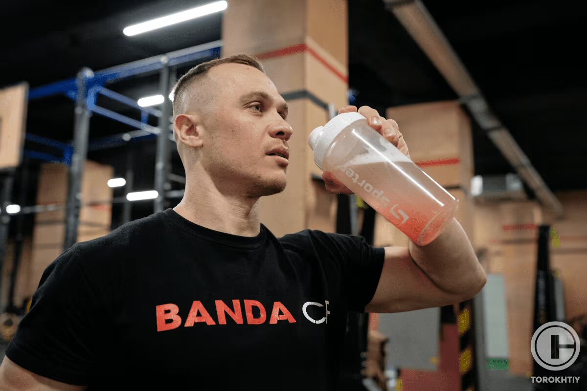 athlete drinks protein shake