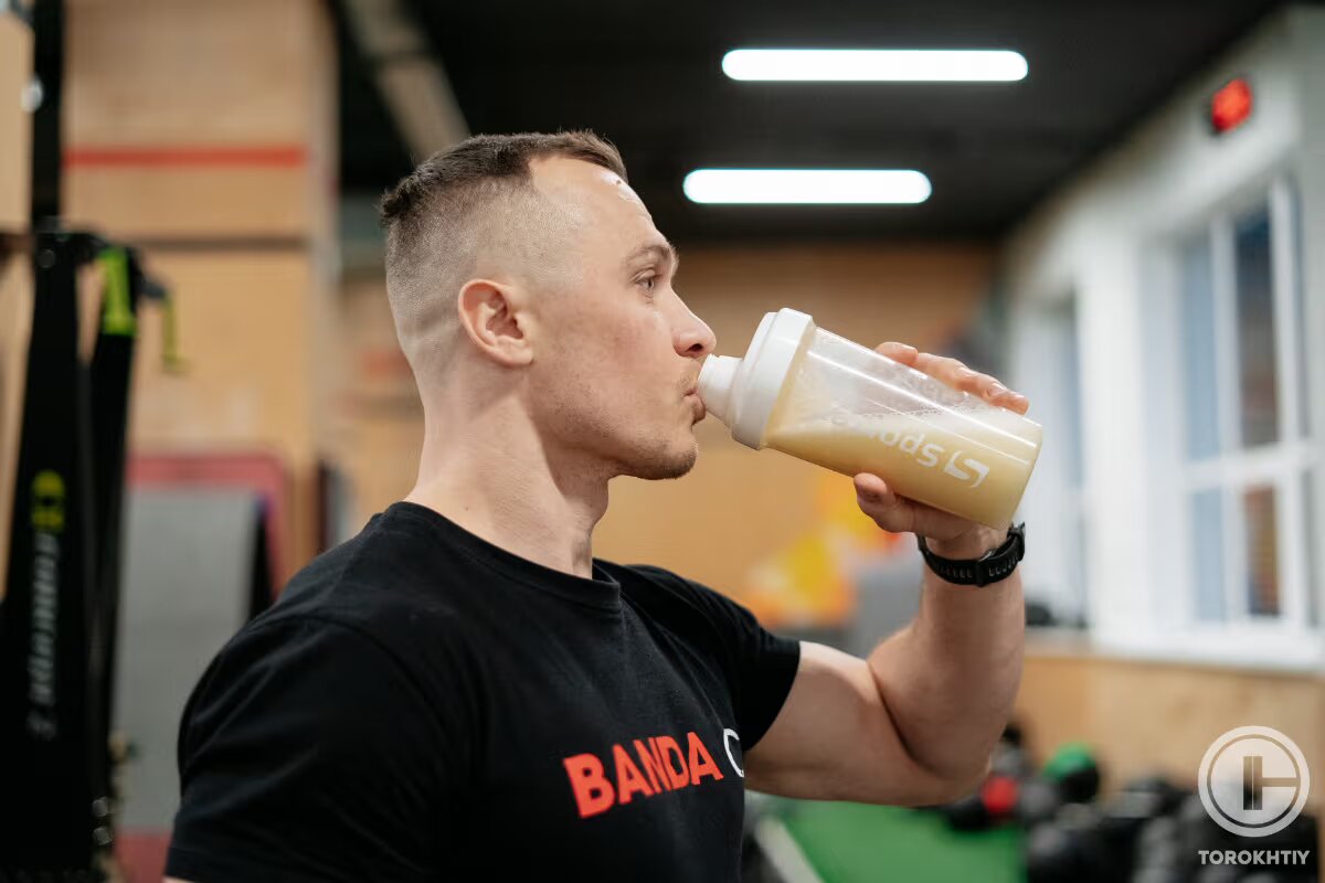 athlete drinks protein shake