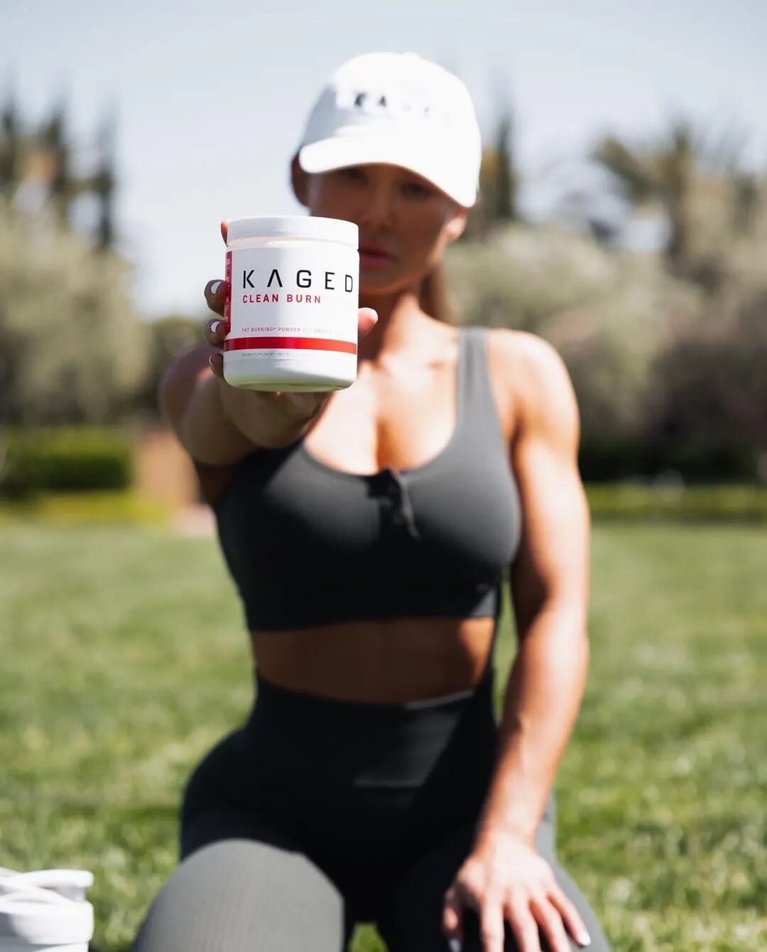 woman holds kaged clean burn powder