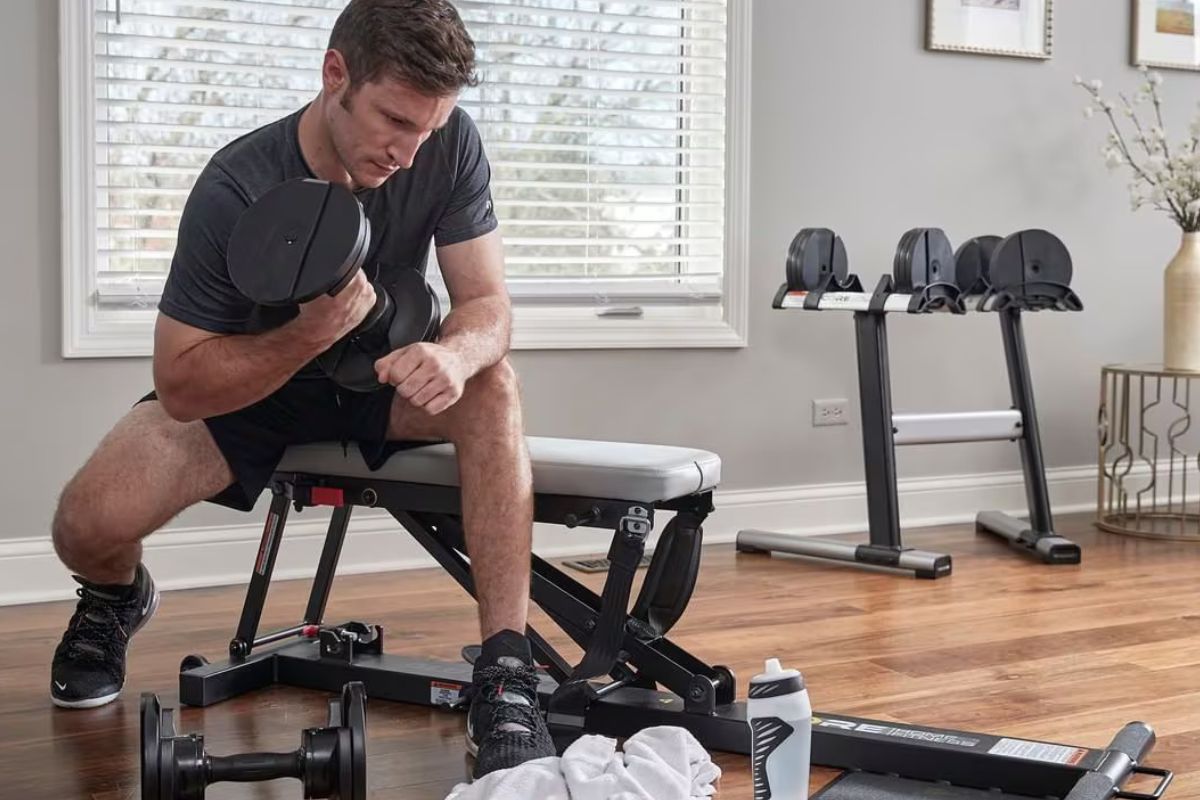 Core Fitness Dumbbells and man working out