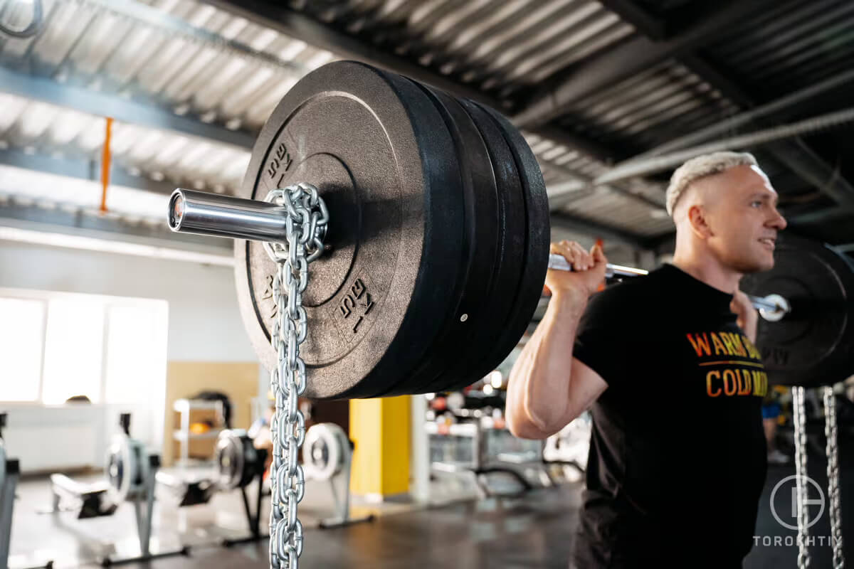 athlete doing workout with barbell