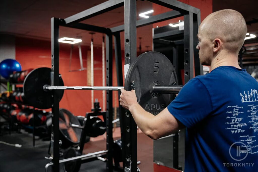 athlete prepares squat stand