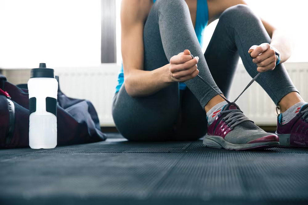 Using A Water Bottle At The Gym