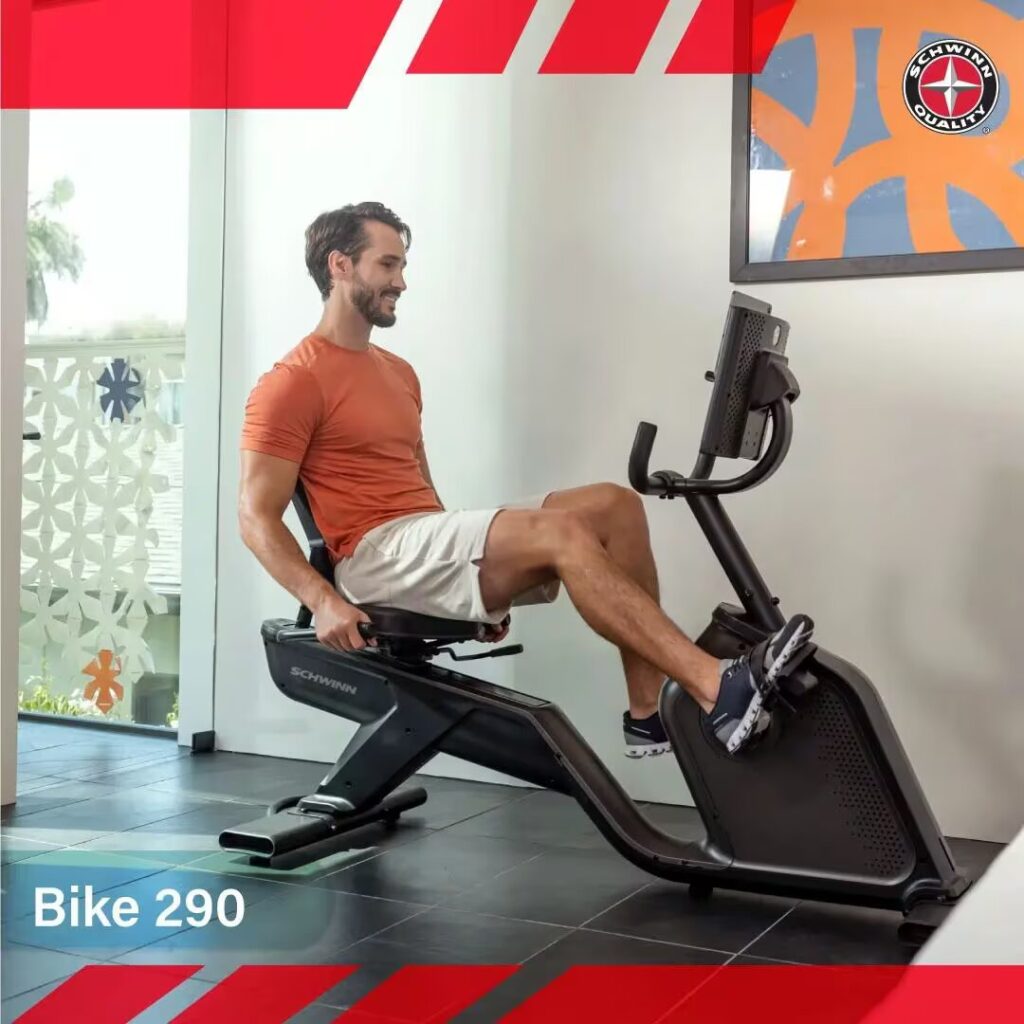 man exercises on schwinn bike at home