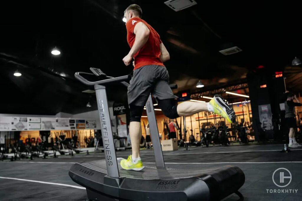 man jogs on treadmill in gym