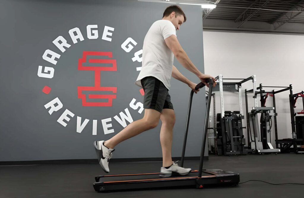 man exercising on treadmill in gym