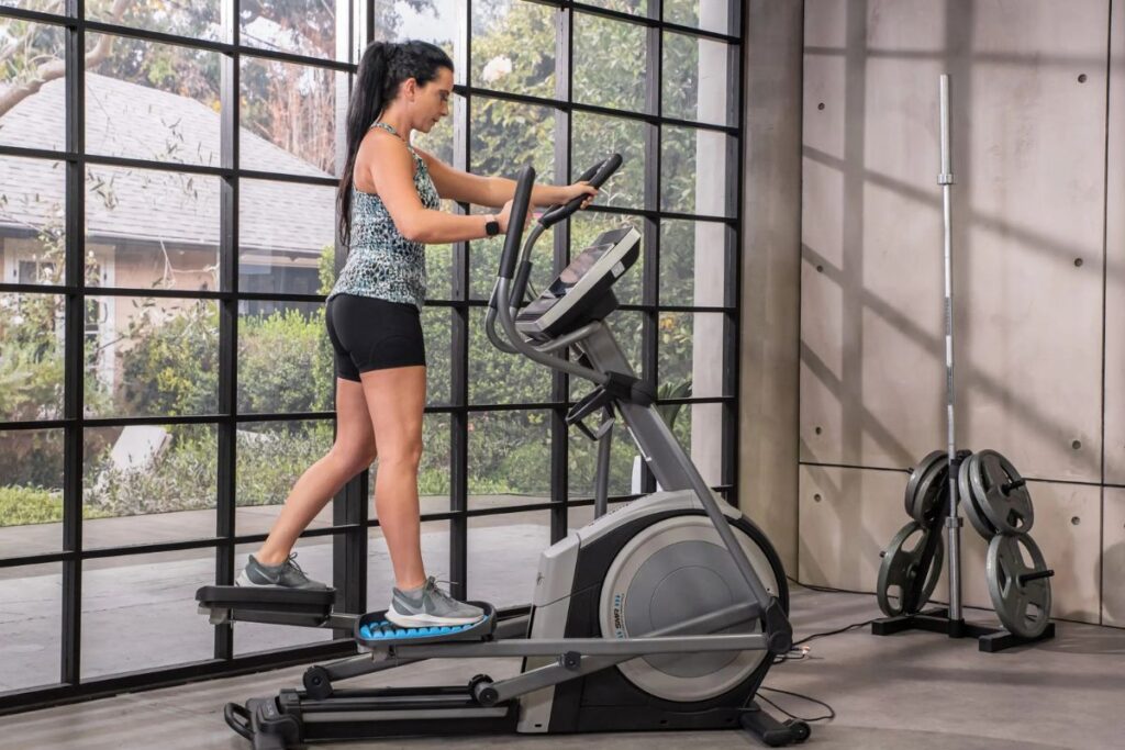 Woman on elliptical exercises