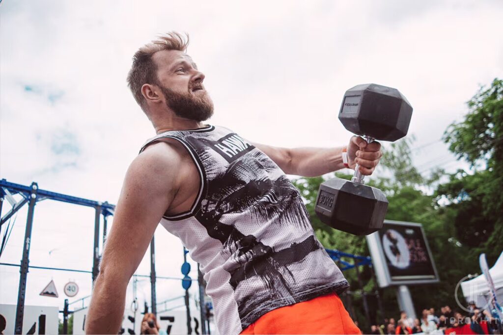 Workout outside with dumbbells torokhtiy