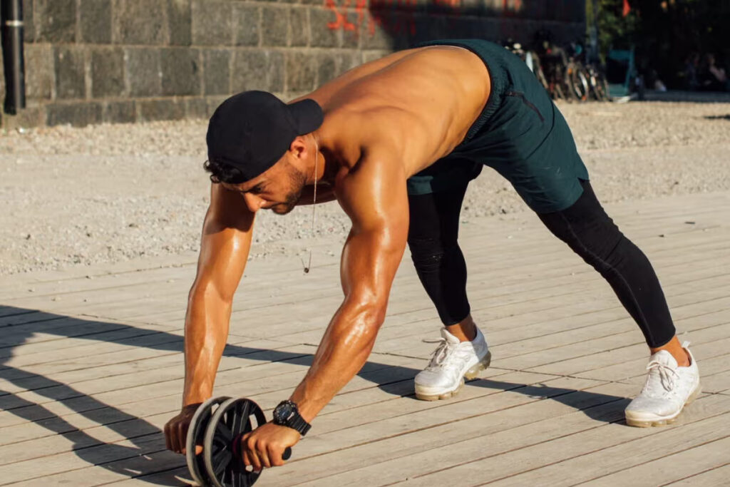 athlete exercising with ab wheel